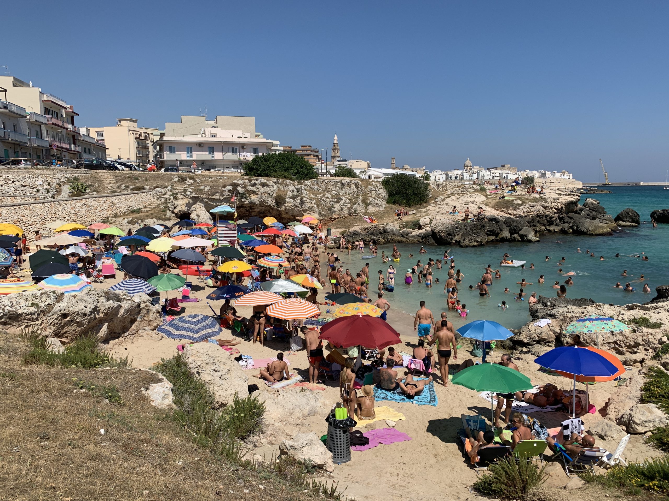 Porto Rosso beach in Monopoli, Puglia, is a bust town beach popular with locals.